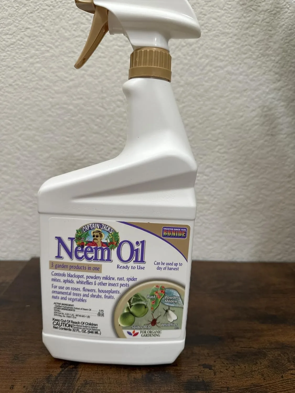 Customer photo of organic pest control spray bottle applied to camellia plant leaves